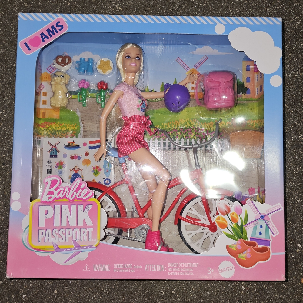 Barbie Pink Passport Doll with Red Bicycle and Purple Helmet